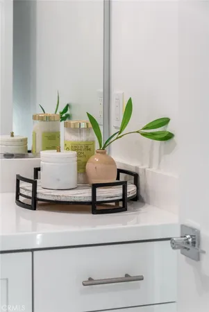 a bathroom with a double vanity sink toilet and shower