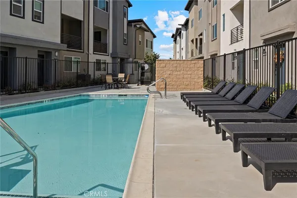a view of an buildings with a swimming pool
