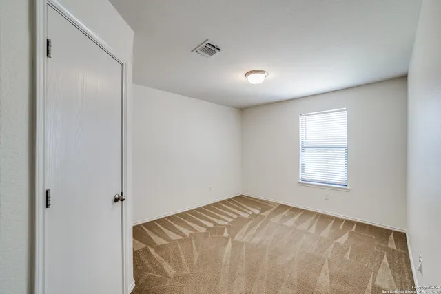 a view of an empty room and window