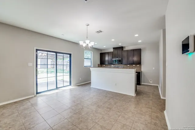 a view of a kitchen with a sink cabinets and window