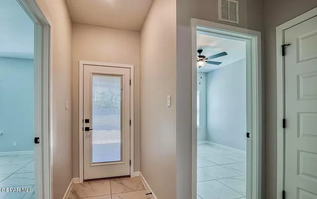 a view of a bathroom from a hallway