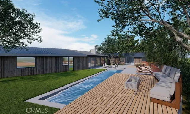 a view of a backyard with sitting area