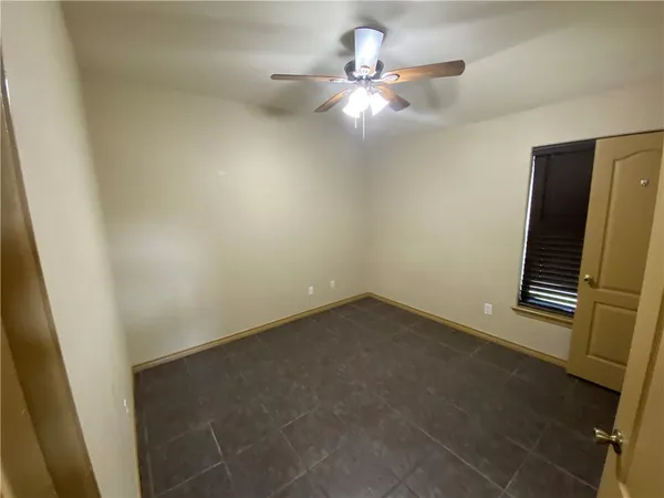 en empty room with windows
