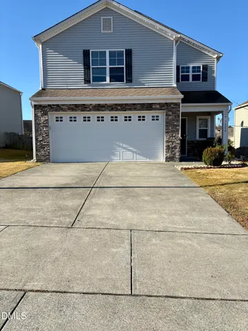 a view of a house with a garage