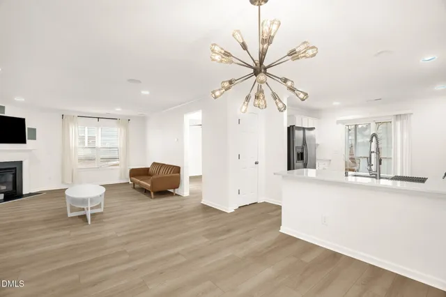 a kitchen with stainless steel appliances a refrigerator sink and cabinets