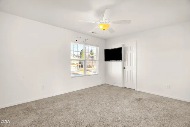 a view of a house with backyard and porch