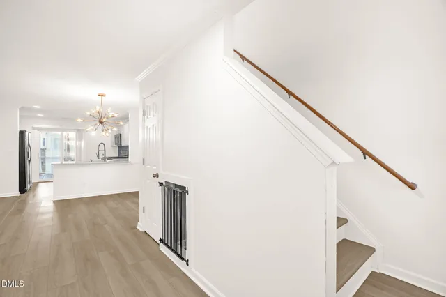 a view of a living room with wooden floor