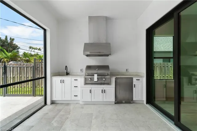 a kitchen with stainless steel appliances a stove and a refrigerator