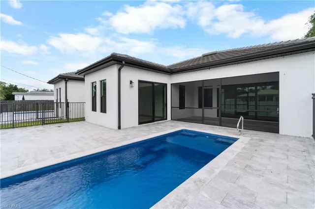 a view of a house with wooden floor and a iron gate