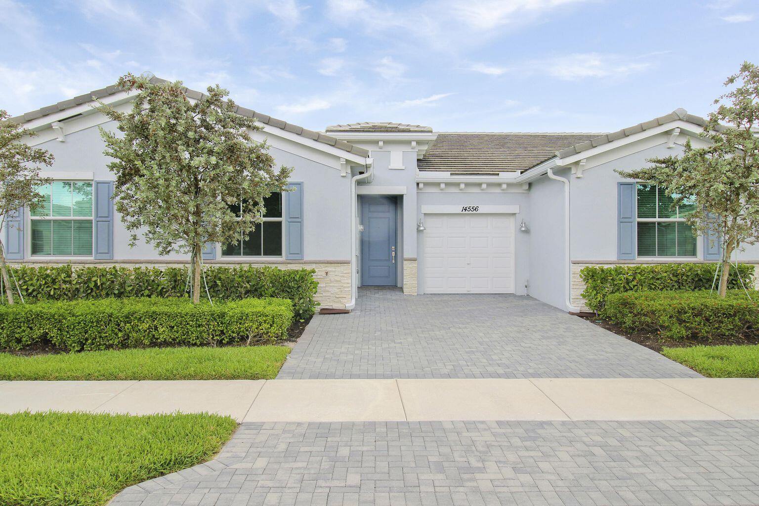 14556 Wiley Range Road Delray Beach, FL 33446 - Photo 1 of 29 a view of a white house next to a yard