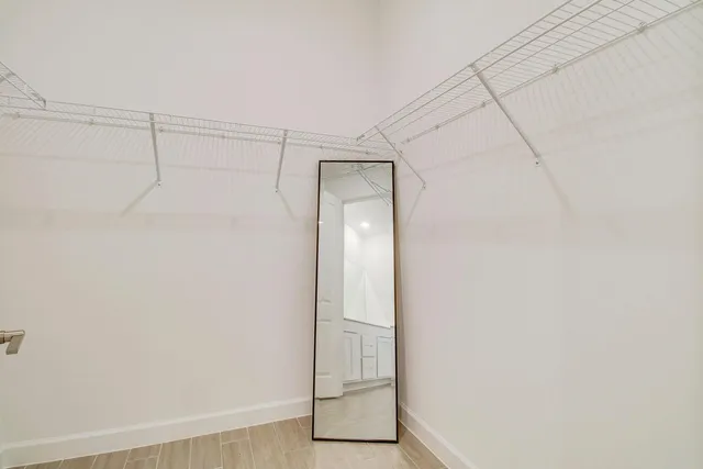 a kitchen with kitchen island a sink window and chandelier