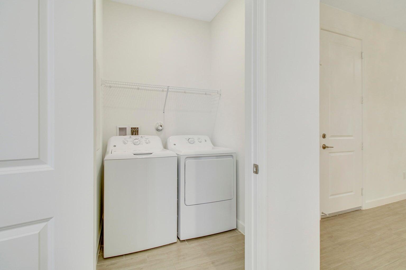 14556 Wiley Range Road Delray Beach, FL 33446 - Photo 22 of 29 a utility room with dryer and washer
