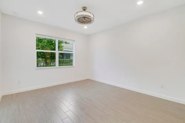 a garden with a table and a potted plant