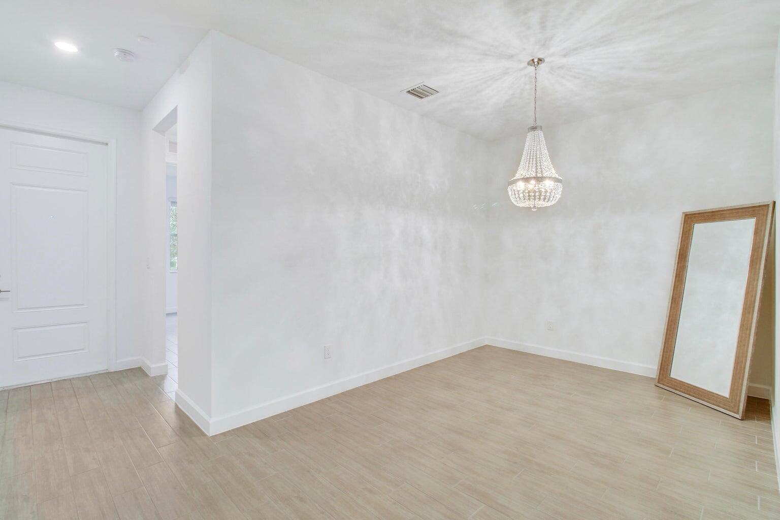 14556 Wiley Range Road Delray Beach, FL 33446 - Photo 9 of 29 en empty room with a window