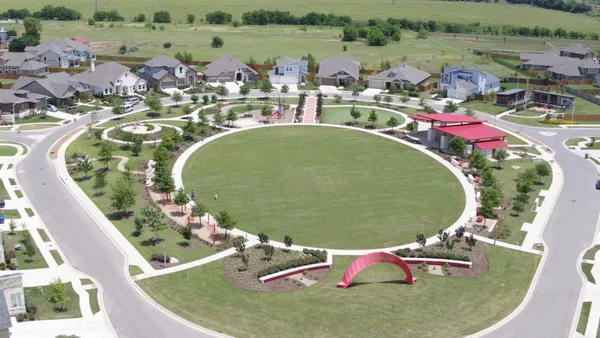 an aerial view of a house with outdoor space