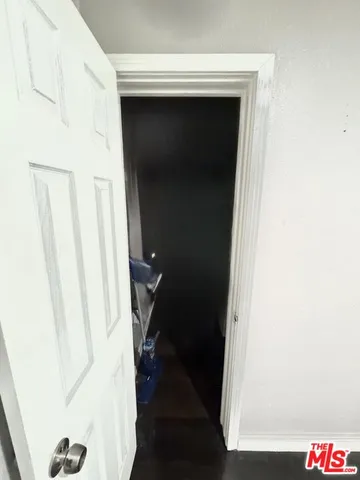 a bathroom with a sink a vanity and a large mirror