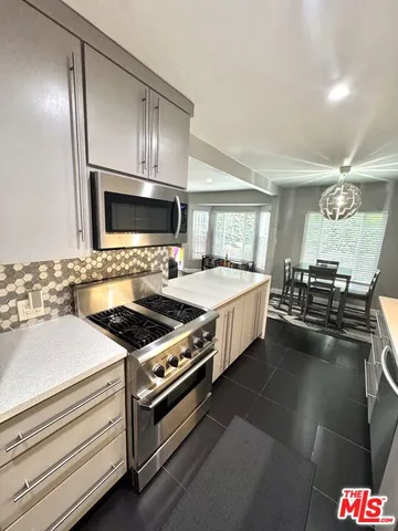 a kitchen with sink and stove