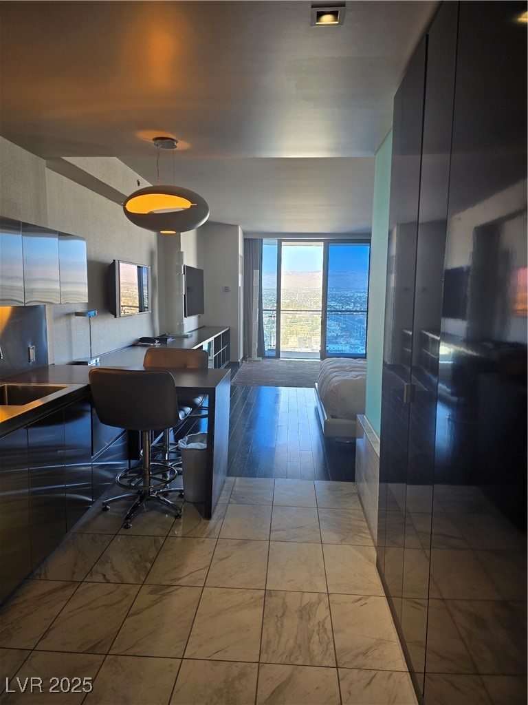 4381 West Flamingo Road, Unit 3109 Las Vegas, NV 89103 - Photo 2 of 28 Living room with marble finish floor