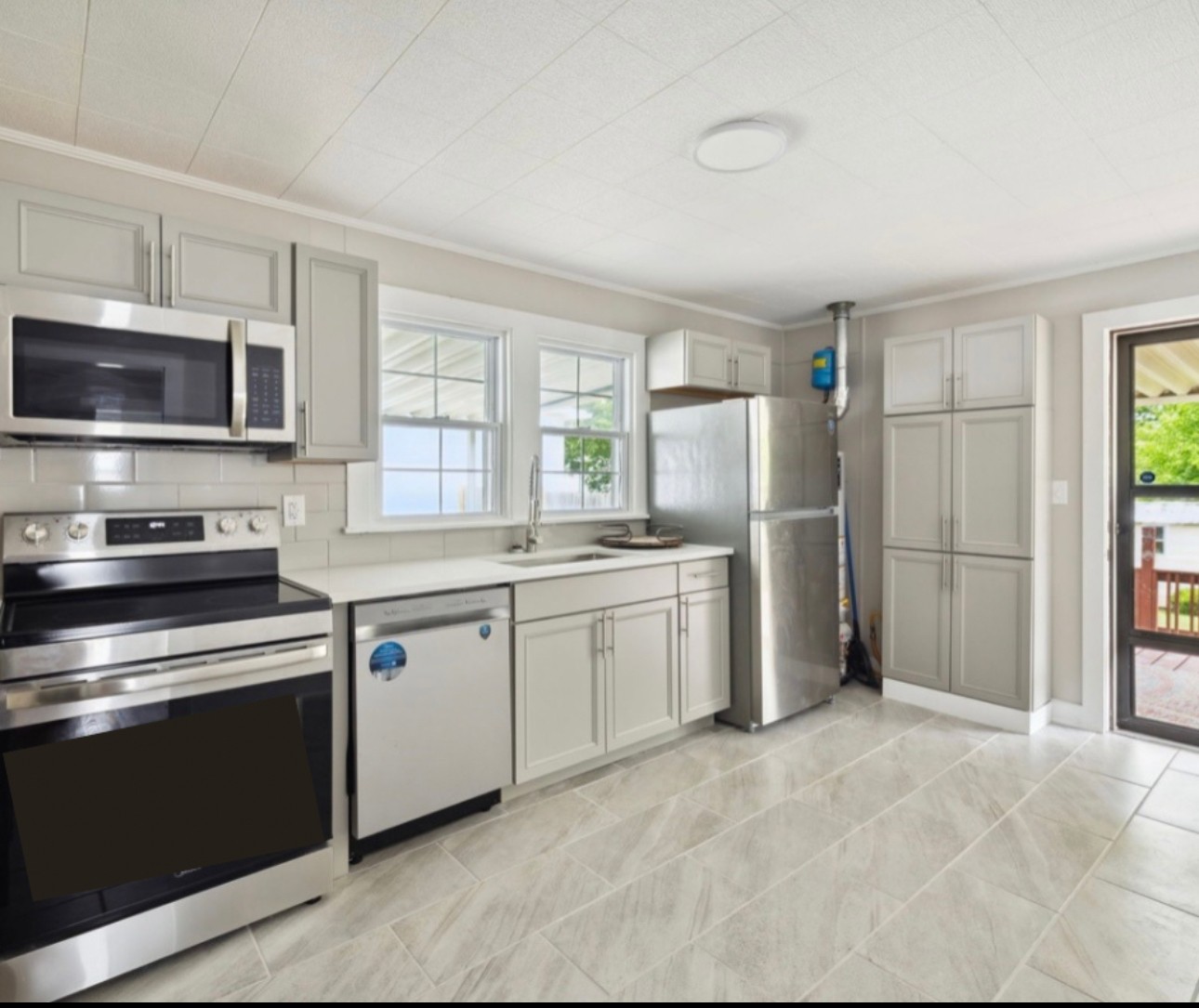 1901 Cherry Street Columbia, TN 38401 - Photo 1 of 58 a kitchen with granite countertop cabinets stainless steel appliances and window