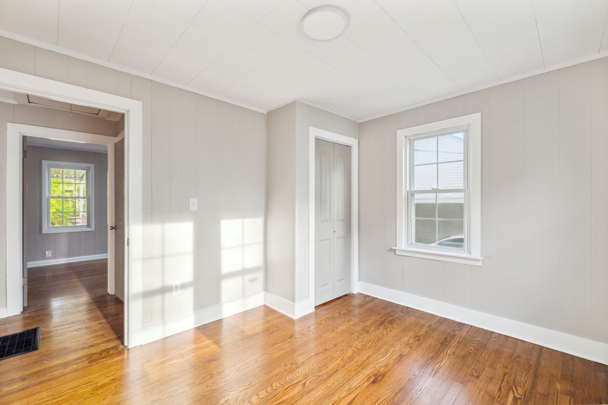 1901 Cherry Street Columbia, TN 38401 - Photo 22 of 58 a view of an empty room with wooden floor and a window