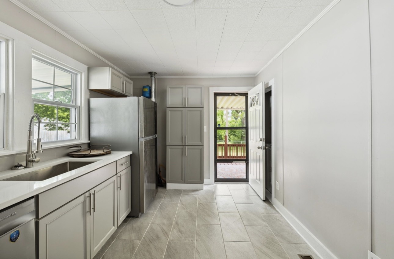 1901 Cherry Street Columbia, TN 38401 - Photo 25 of 58 a kitchen with a refrigerator a sink and a window