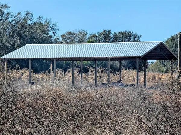 a view of a yard with an outdoor space