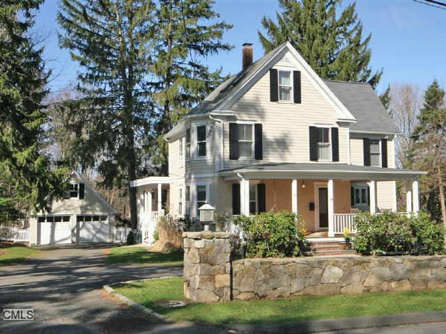 19 New Street Ridgefield, CT 06877 - Photo 1 of 1 a front view of a house with a yard