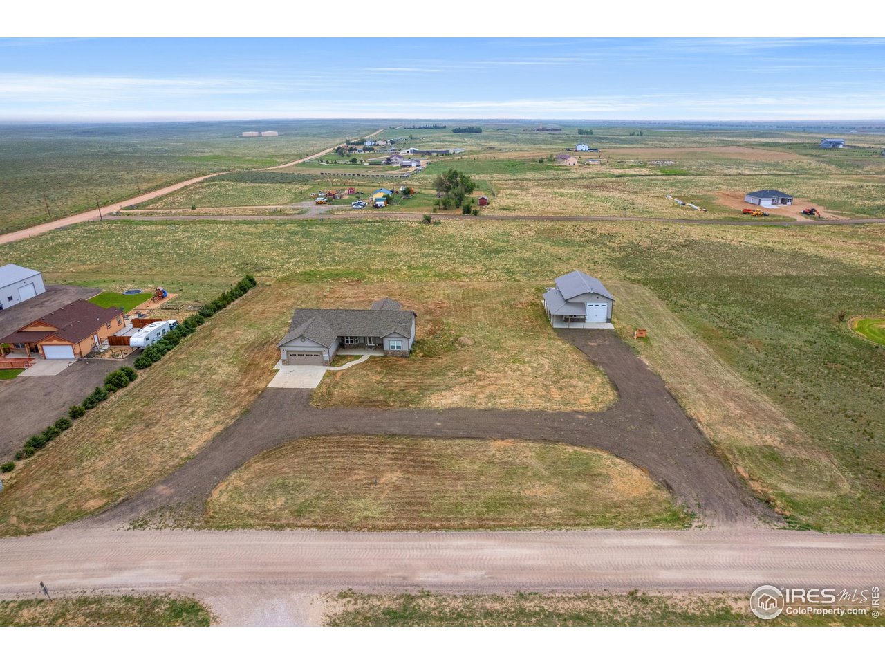 7908 P 3 Road Wiggins, CO 80654 - Photo 1 of 40 Aerial view showcasing the expansive 2.03 acre lot, home, and large heated shop.