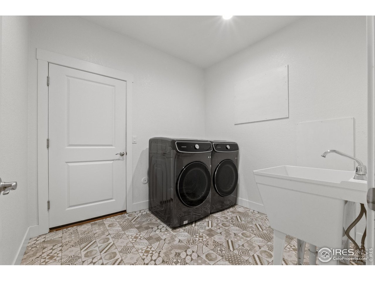 7908 P 3 Road Wiggins, CO 80654 - Photo 20 of 40 Functional laundry and mudroom with garage access-perfect for everyday convenience and clean entry.