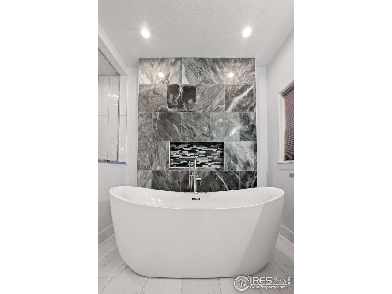 7908 P 3 Road Wiggins, CO 80654 - Photo 24 of 40 Luxurious jetted soaking tub offers the perfect place to unwind and relax.