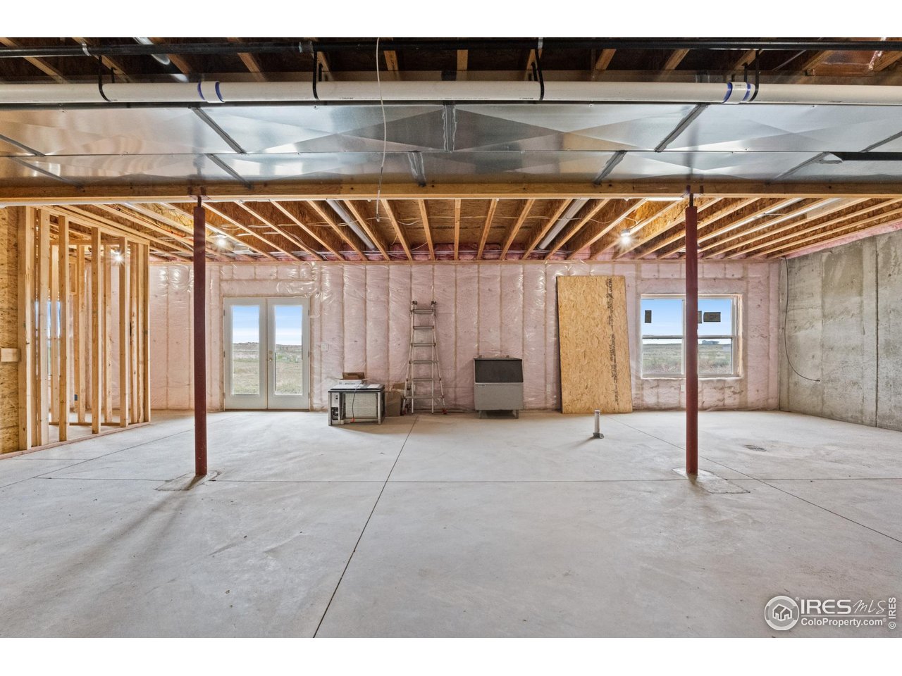 7908 P 3 Road Wiggins, CO 80654 - Photo 30 of 40 Expansive unfinished walkout basement with tall ceilings-ready for your custom touch.