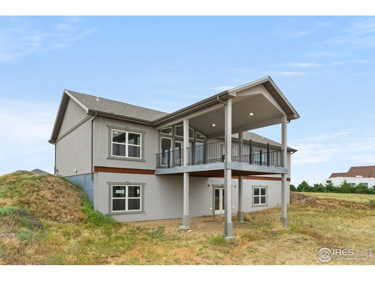 7908 P 3 Road Wiggins, CO 80654 - Photo 32 of 40 Covered 20'x15' back deck-perfect for outdoor dining, relaxing, and enjoying wide-open views.
