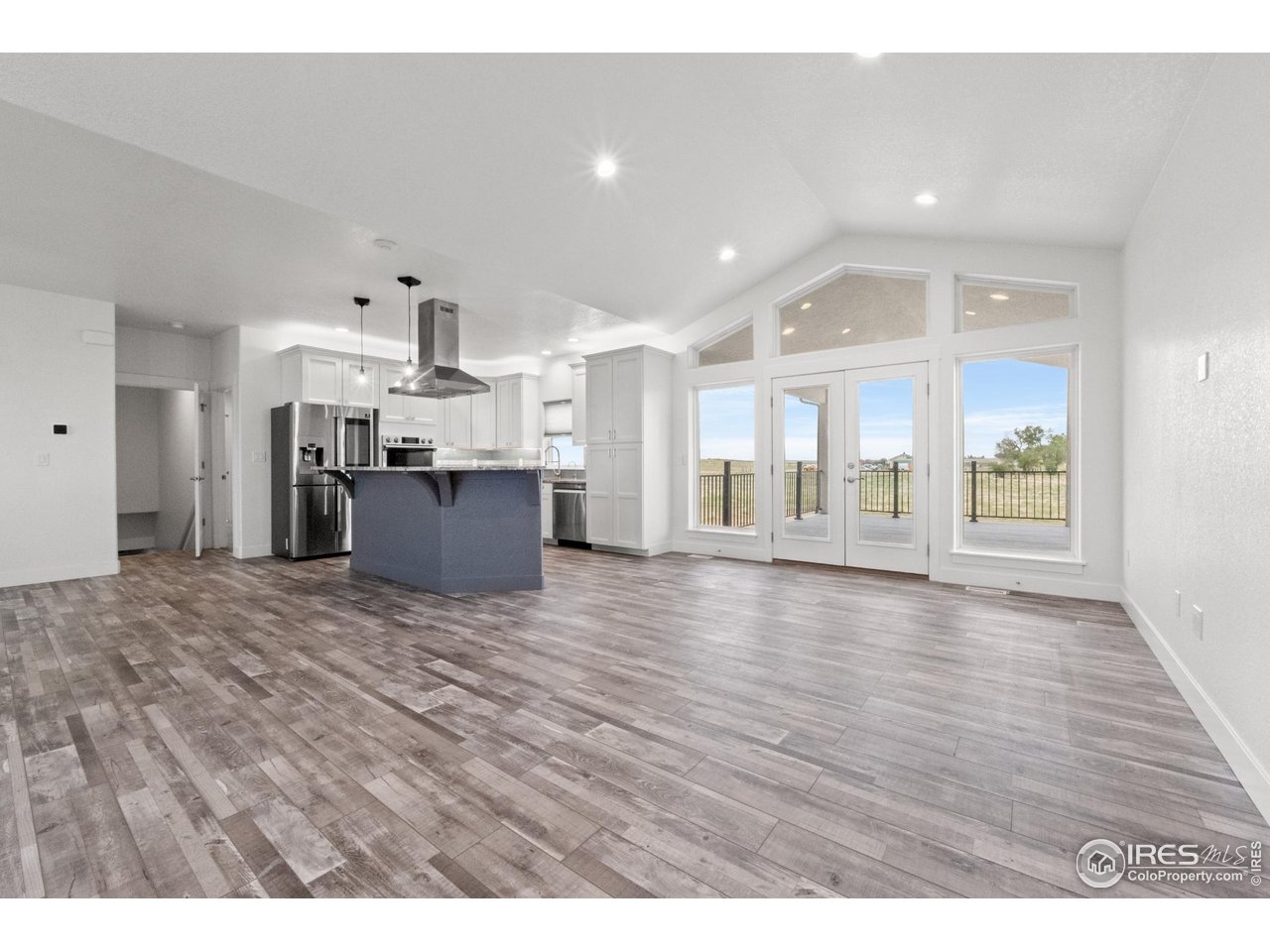 7908 P 3 Road Wiggins, CO 80654 - Photo 4 of 40 Welcoming entryway with vaulted ceilings and a clear view into the open-concept living space.