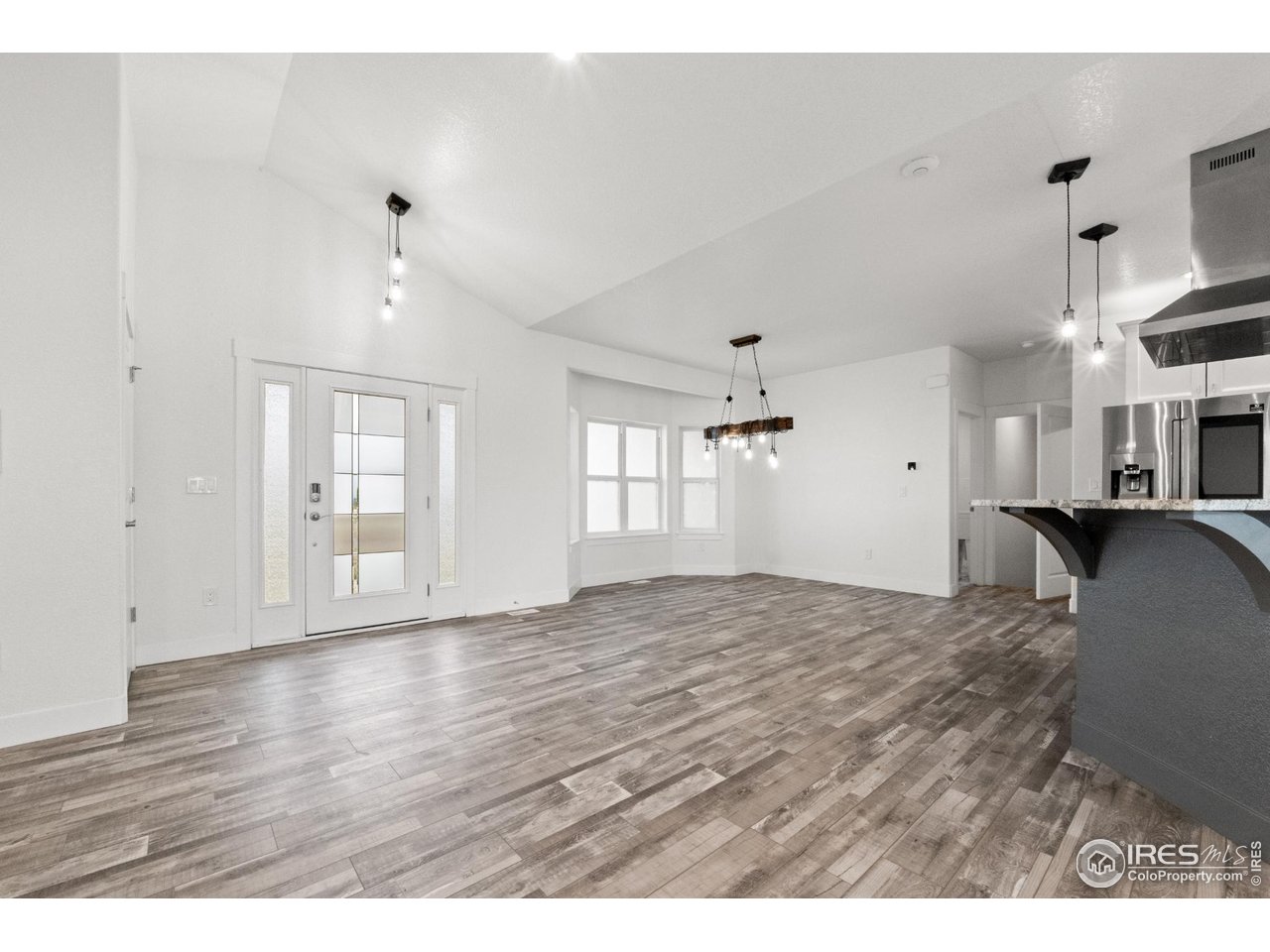7908 P 3 Road Wiggins, CO 80654 - Photo 5 of 40 Spacious open-concept dining area filled with natural light and perfect for entertaining.