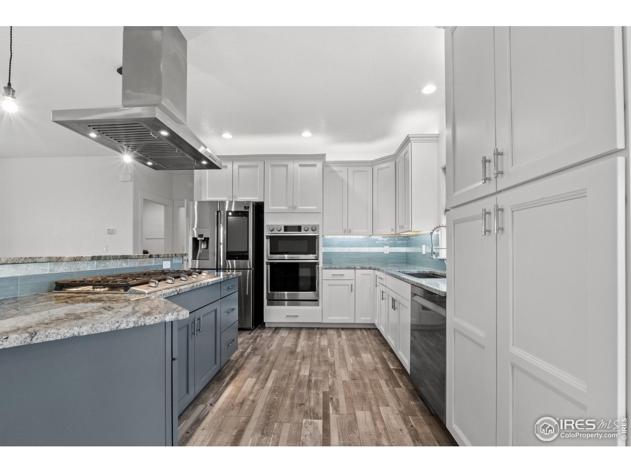 7908 P 3 Road Wiggins, CO 80654 - Photo 7 of 40 Sleek stainless steel smart appliances blend modern convenience with high-end design.