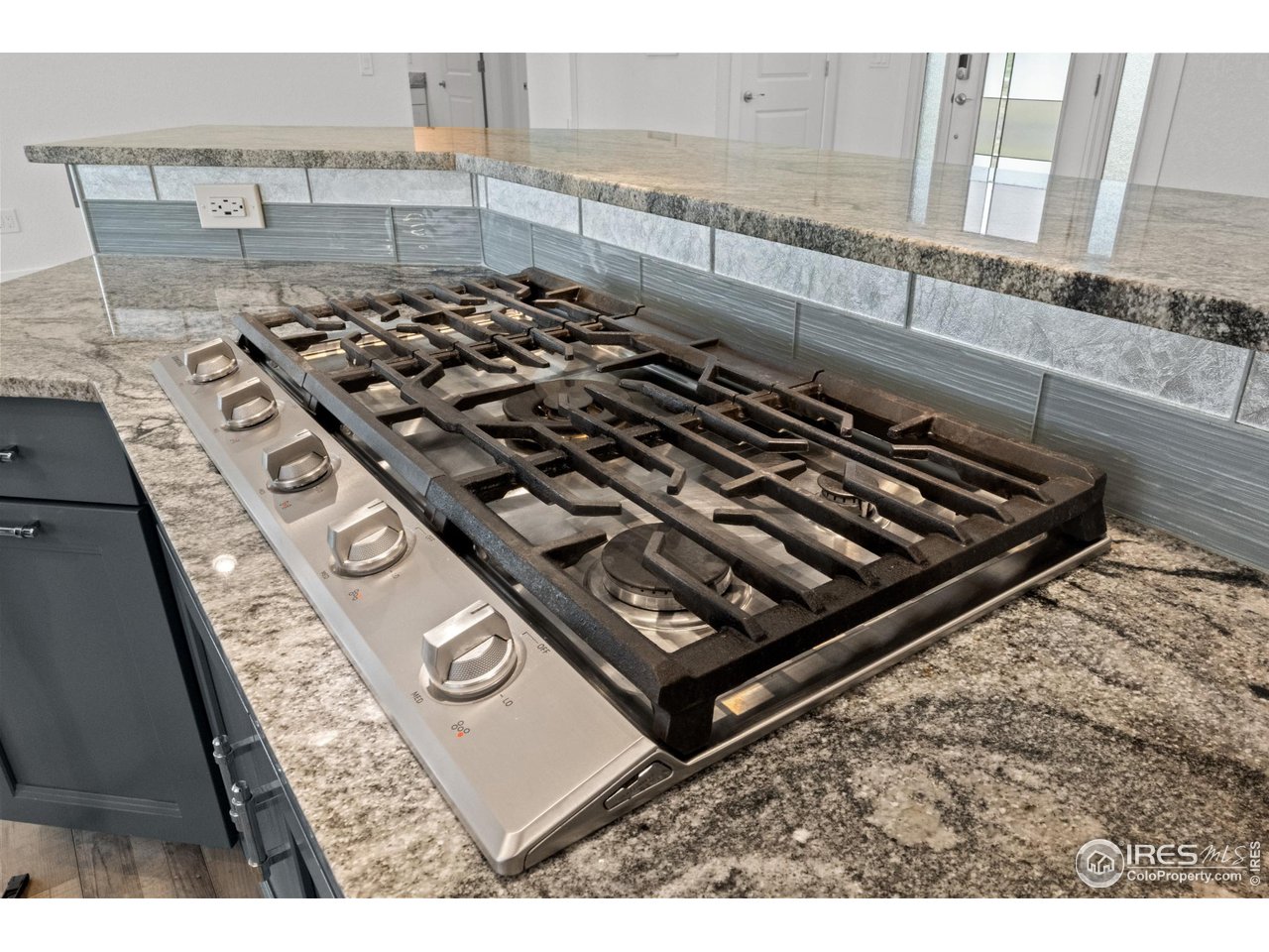7908 P 3 Road Wiggins, CO 80654 - Photo 8 of 40 Premium 5-burner gas range offers precision cooking for the home chef.