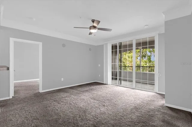a view of an empty room with a window
