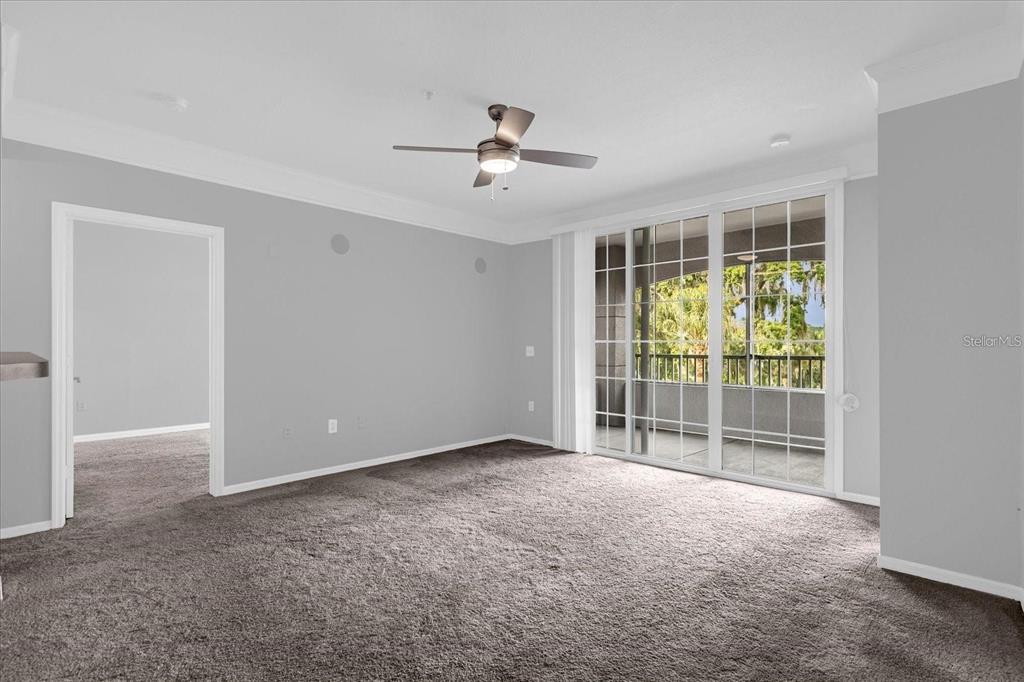 3250 Corona Village Way, Unit 102 Orlando, FL 32835 - Photo 11 of 33 a view of an empty room with a window