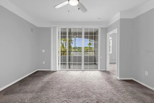 a view of wooden floor and windows in a room