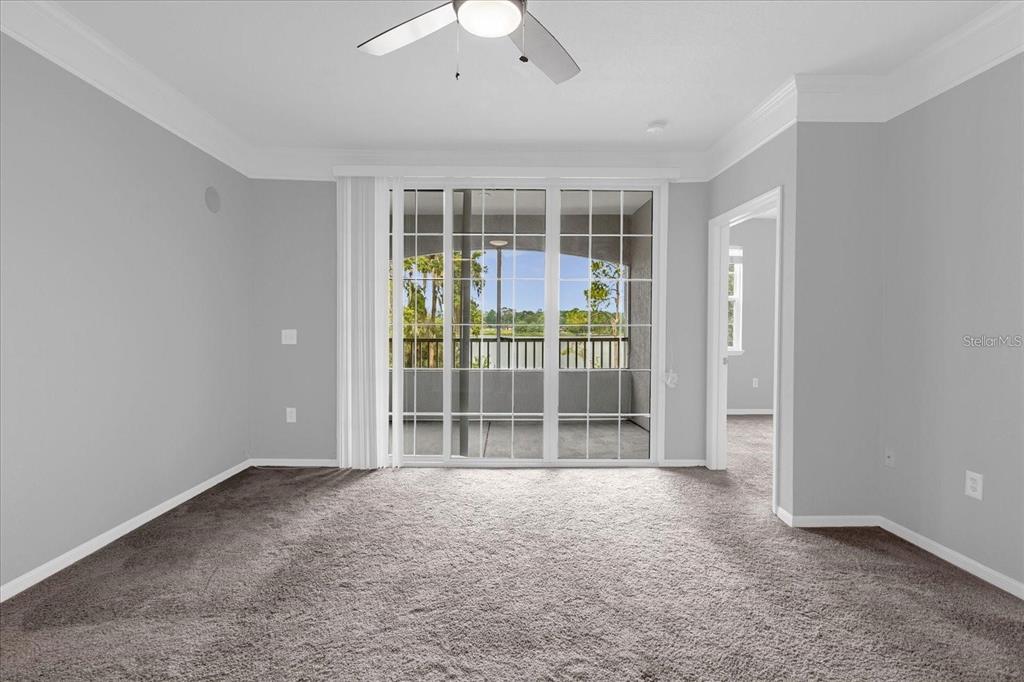 3250 Corona Village Way, Unit 102 Orlando, FL 32835 - Photo 13 of 33 a view of wooden floor and windows in a room