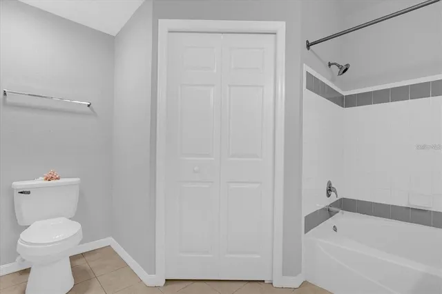 a bathroom with a toilet and a bathtub