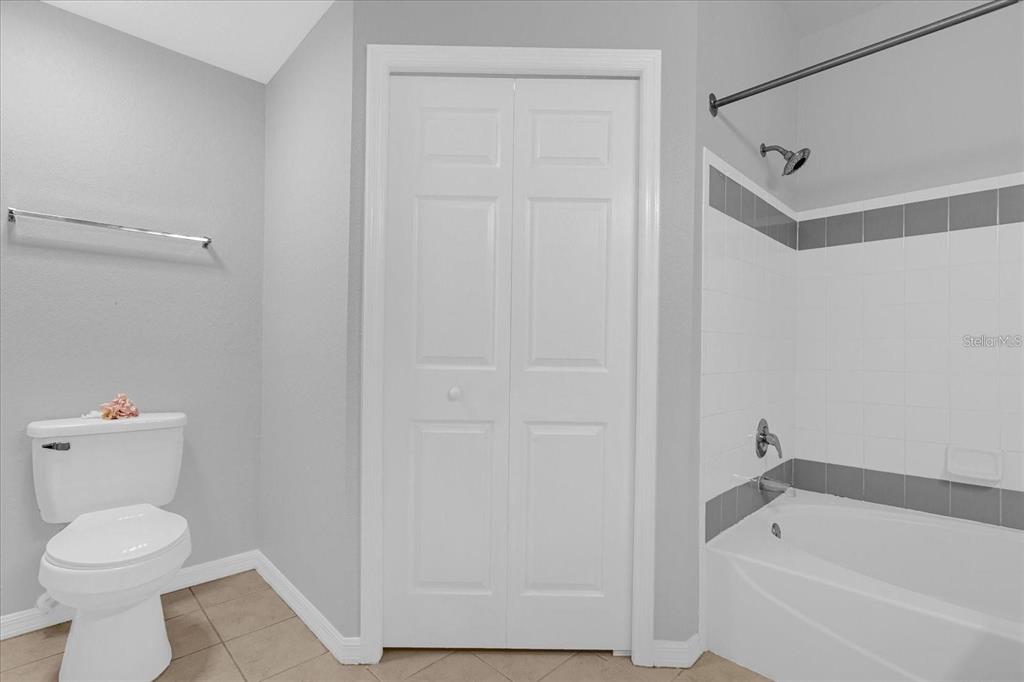 3250 Corona Village Way, Unit 102 Orlando, FL 32835 - Photo 19 of 33 a bathroom with a toilet and a bathtub