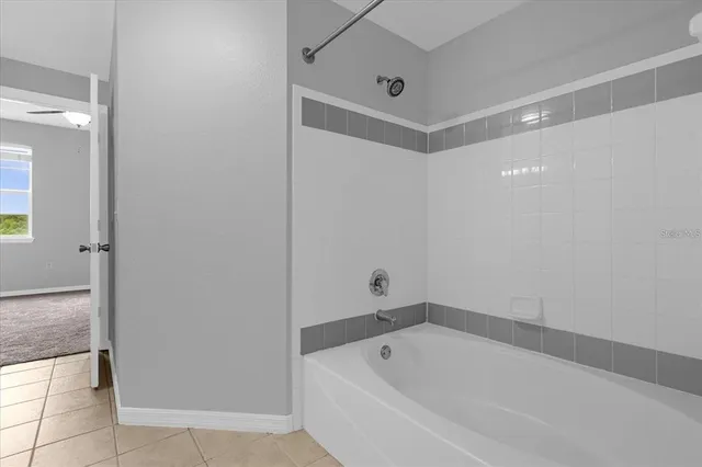 a white bath tub sitting in a bathroom