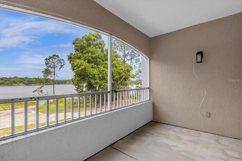 3250 Corona Village Way, Unit 102 Orlando, FL 32835 - Photo 24 of 33 a view of a balcony with lake view
