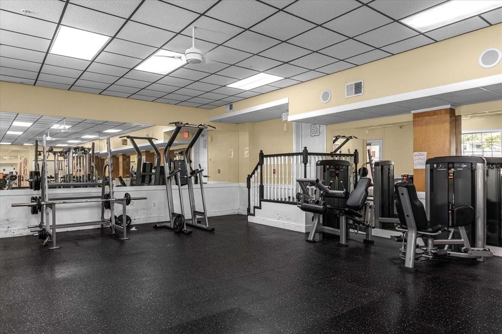 3250 Corona Village Way, Unit 102 Orlando, FL 32835 - Photo 31 of 33 a view of a room with gym equipment