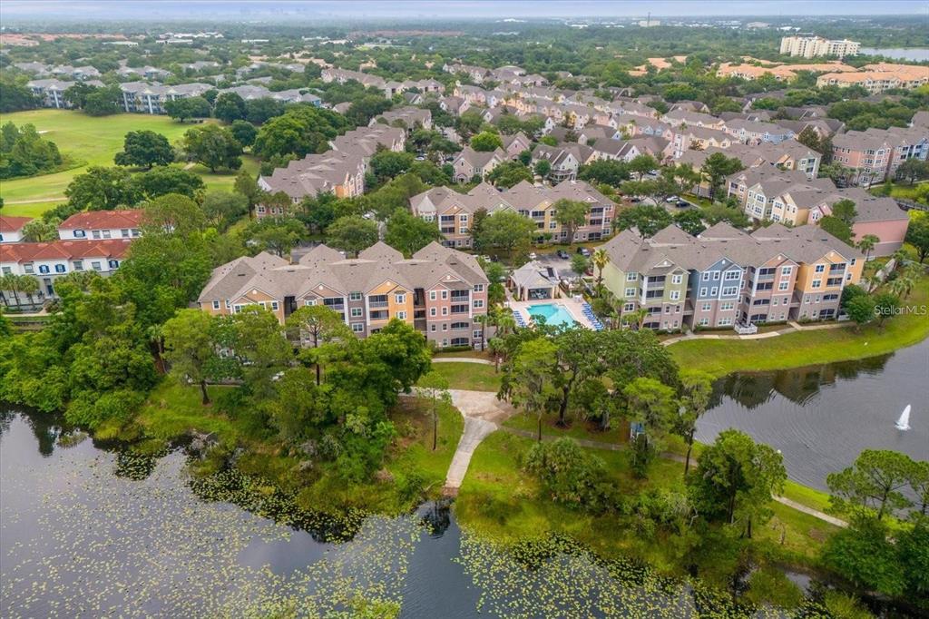 3250 Corona Village Way, Unit 102 Orlando, FL 32835 - Photo 33 of 33 an aerial view of residential houses with outdoor space and river view