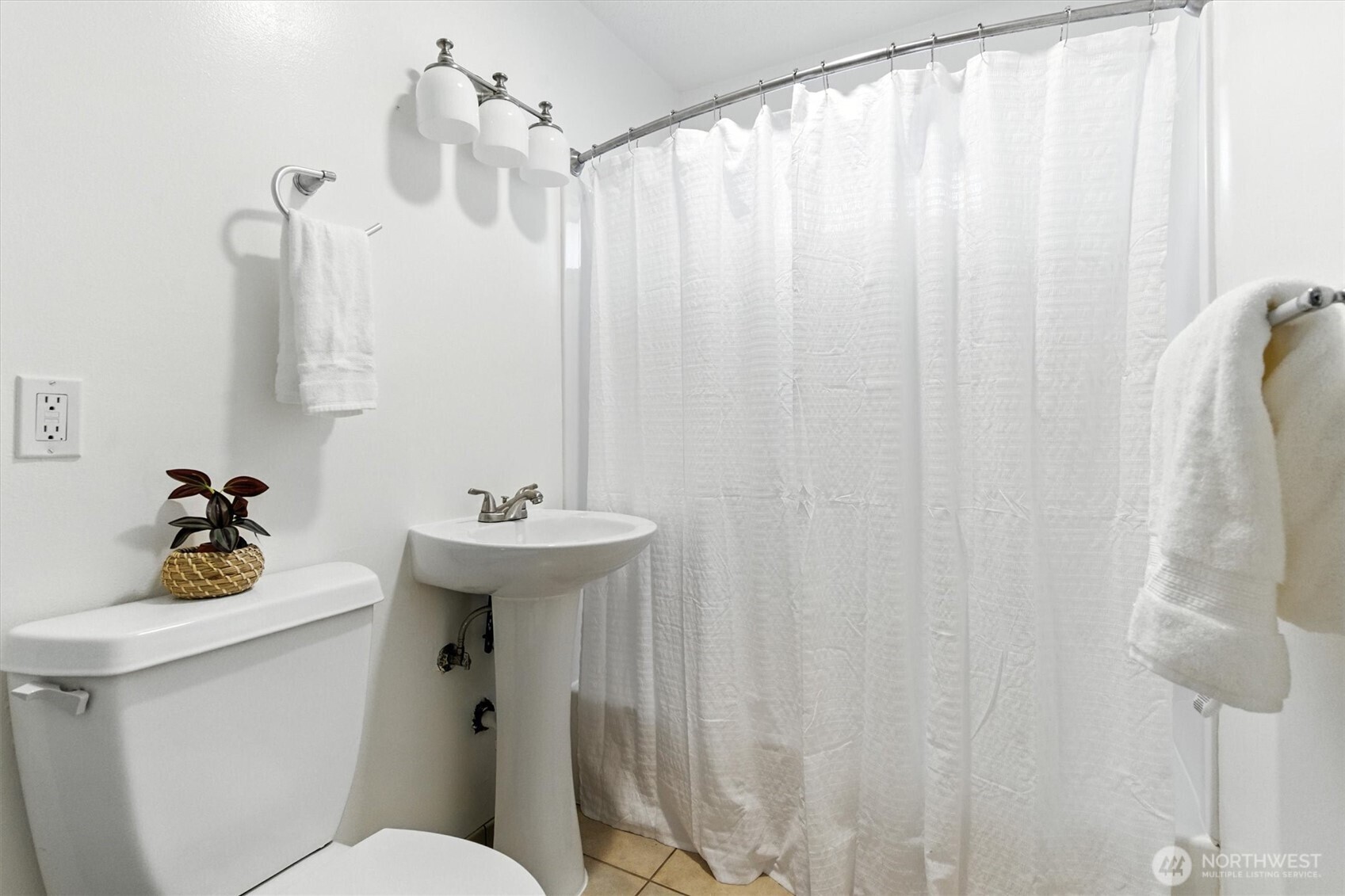 2510 Stephenson Avenue Bremerton, WA 98310 - Photo 15 of 40 a bathroom with a sink a toilet and shower curtain