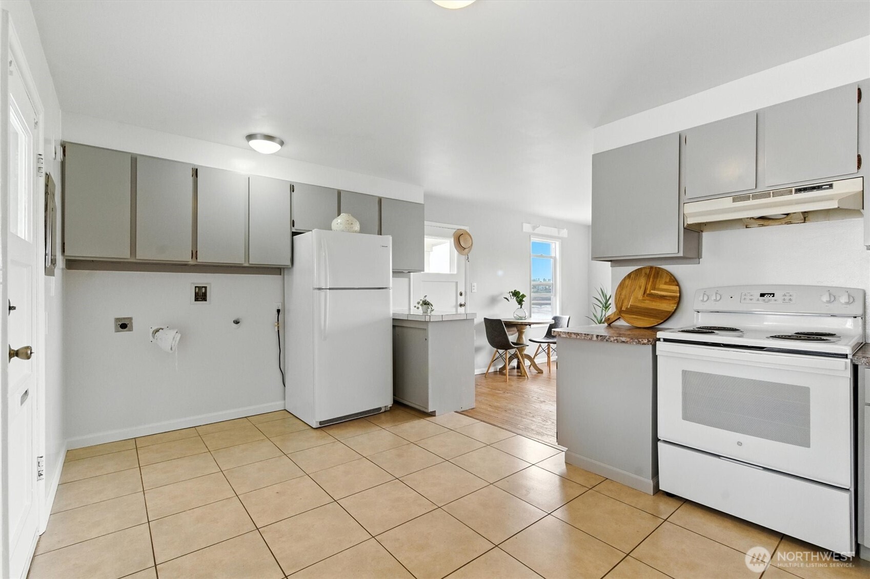 2510 Stephenson Avenue Bremerton, WA 98310 - Photo 22 of 40 a kitchen with a sink a stove a refrigerator and cabinets