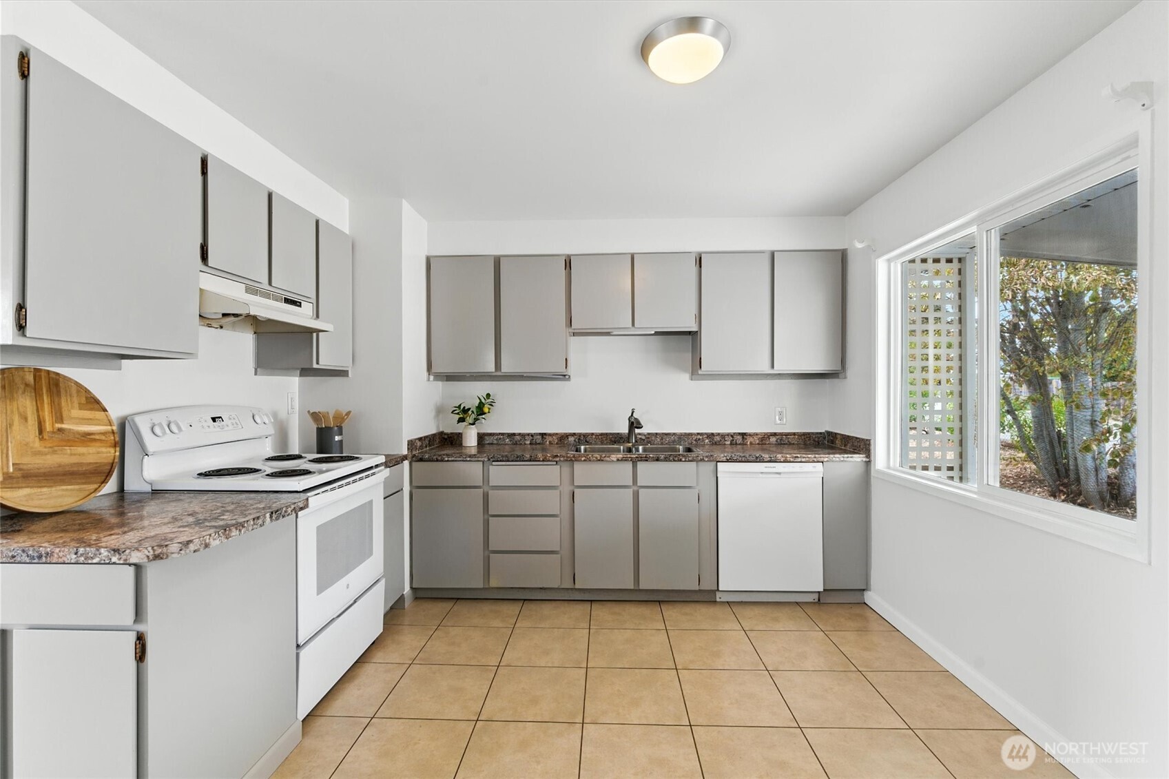 2510 Stephenson Avenue Bremerton, WA 98310 - Photo 23 of 40 a kitchen with a stove top oven sink and cabinets