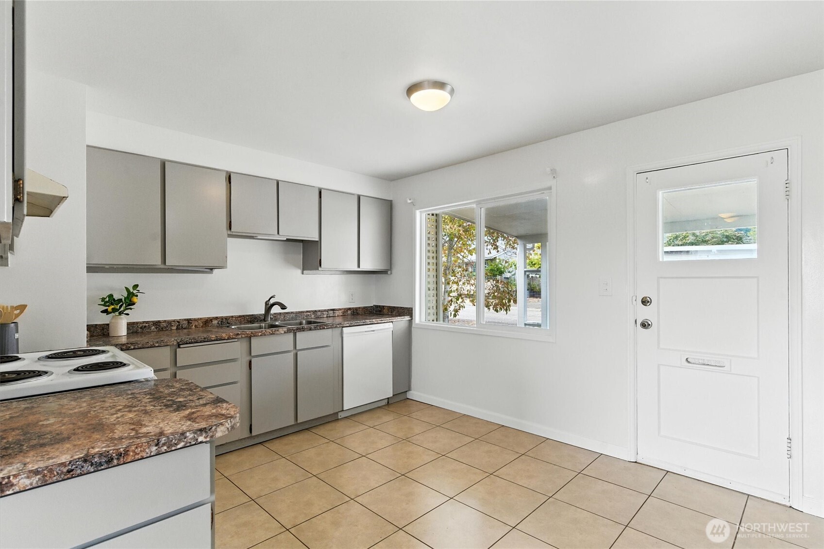 2510 Stephenson Avenue Bremerton, WA 98310 - Photo 24 of 40 a kitchen with stainless steel appliances granite countertop a sink stove and cabinets
